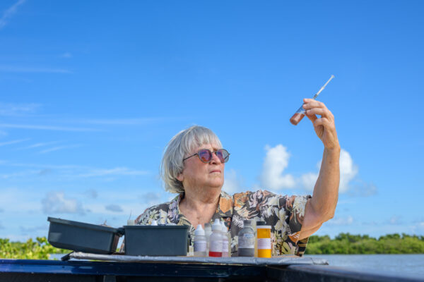 Photo by Jason Gulley/Wildpath. Laurilee Thompson, a fifth generation Floridian and co-owner of the famed Dixie Crossroads seafood restaurant in Titusville, Fla. tests the water quality in Mosquito Lagoon.