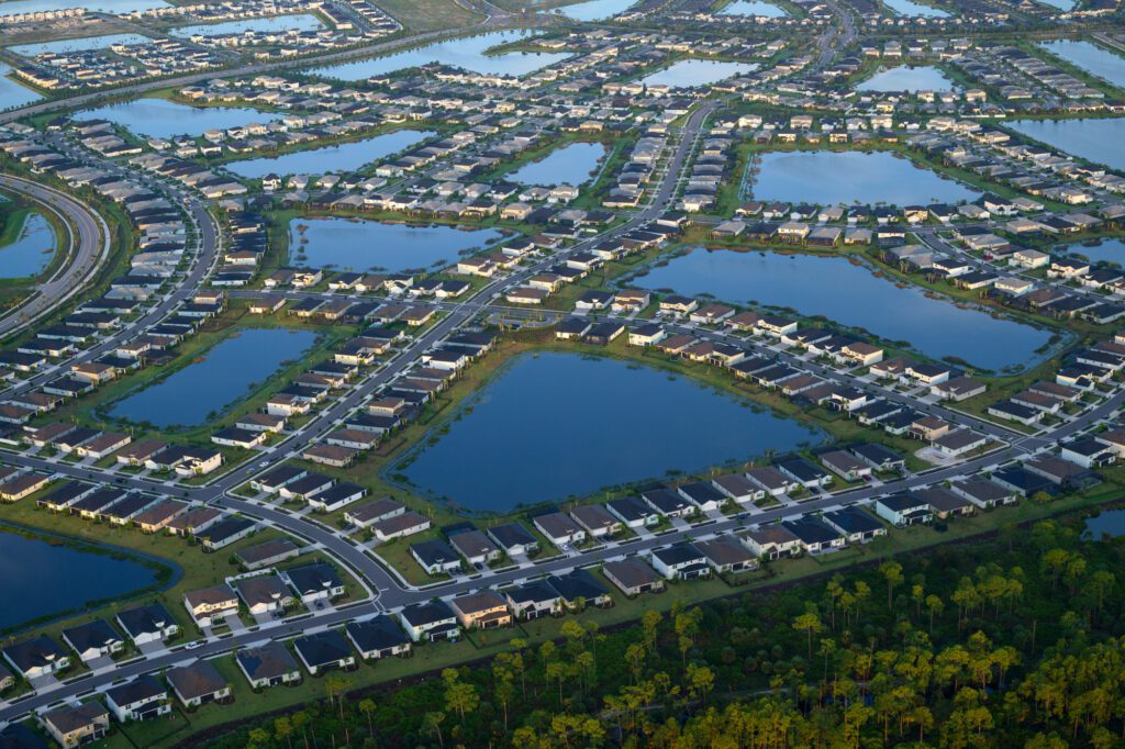 Photo by Jason Gulley/Wildpath. Interconnected networks of  smart ponds store stormwater runoff and reduce flood risks in the Babcock Ranch development in Charlotte County, Fla. Water stored in ponds is eventually routed through wetlands for additional treatment to reduce nutrient pollution before being returned to the environment.