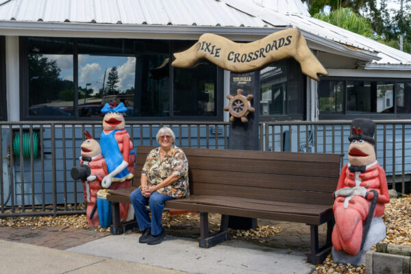 Photo by Jason Gulley/Wildpath. Laurilee Thompson, a fifth generation Floridian and co-owner of the famed Dixie Crossroads seafood restaurant in Titusville, Fla. sits in front of her restaurant.